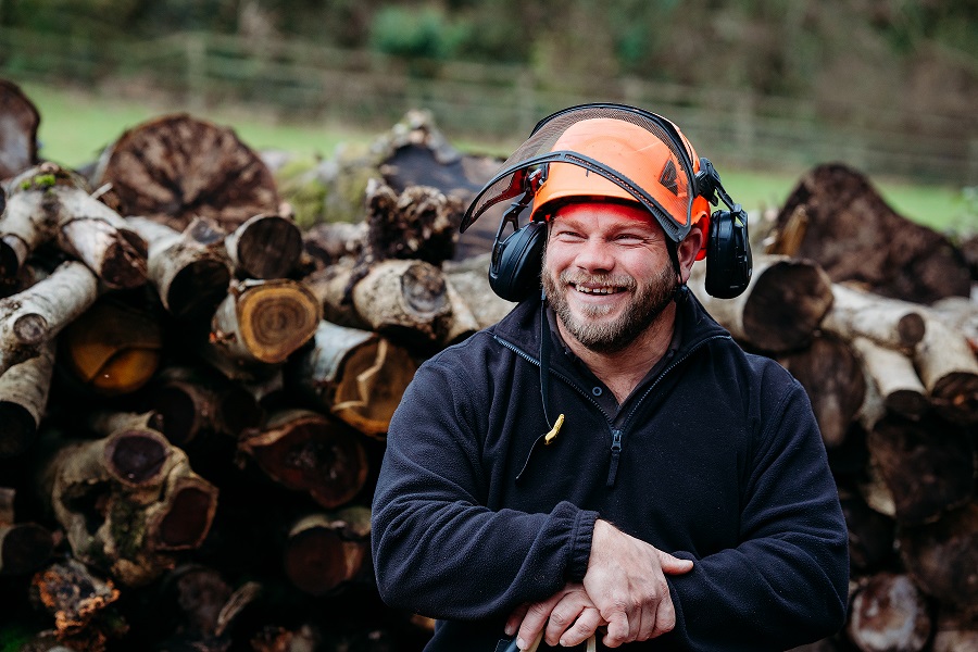 Happy arborist wearing safety gear