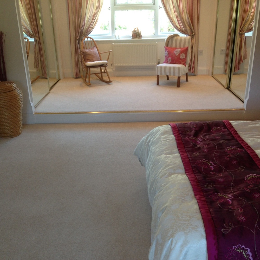 Grand bedroom with raised dressing area