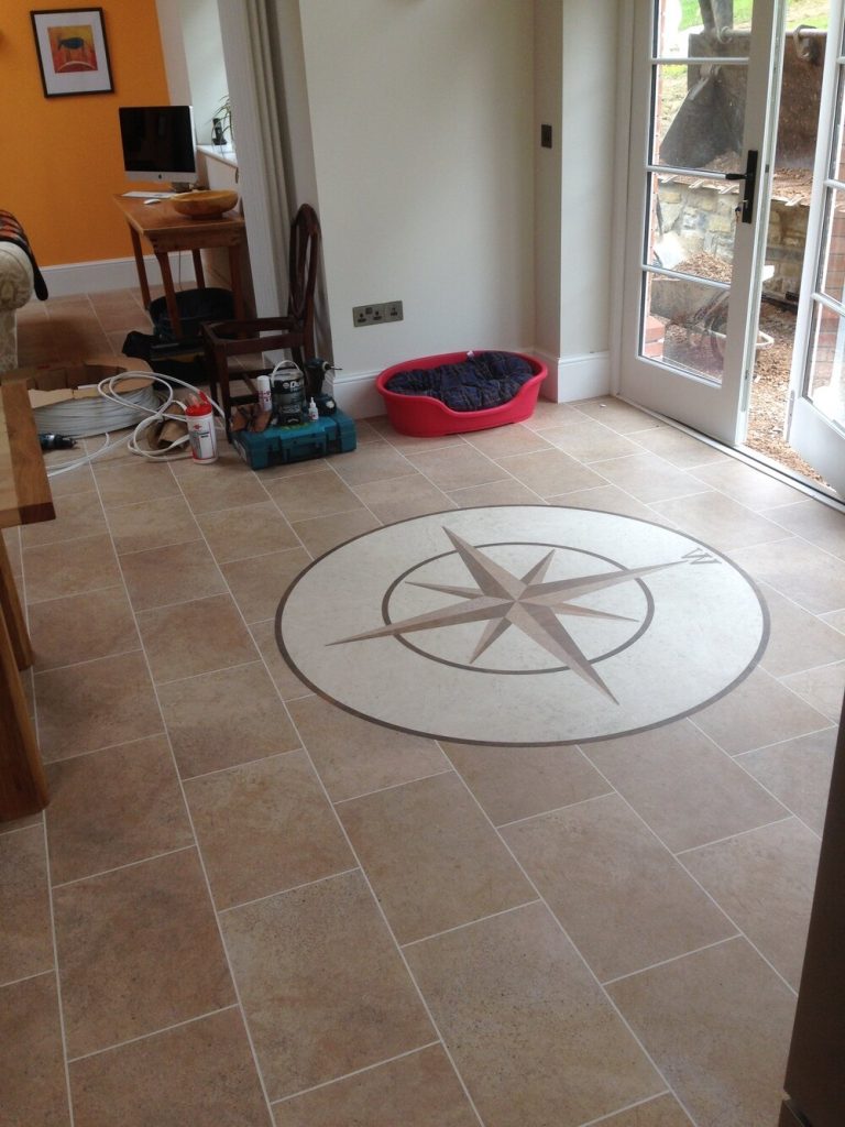 Tiled floor with large compass feature