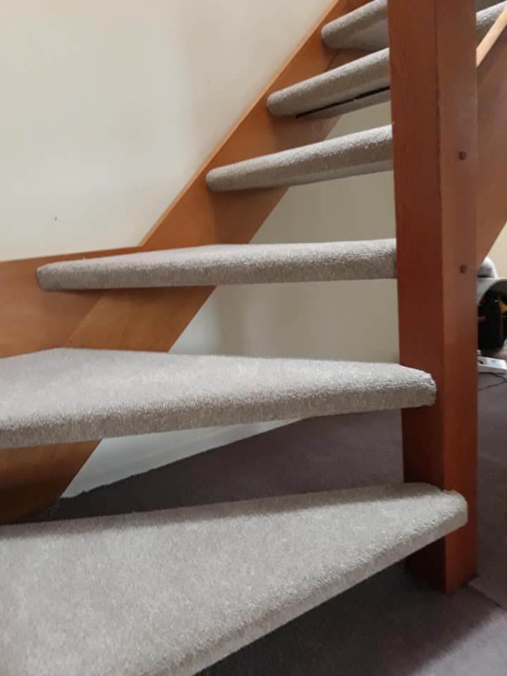 Complex carpeting on exposed stair wind
