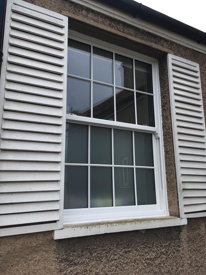Sash window with shutters