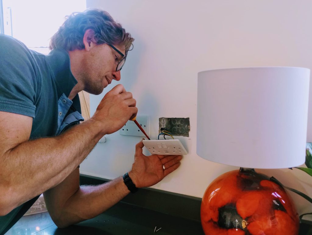Exeter Electrician installing plug socket